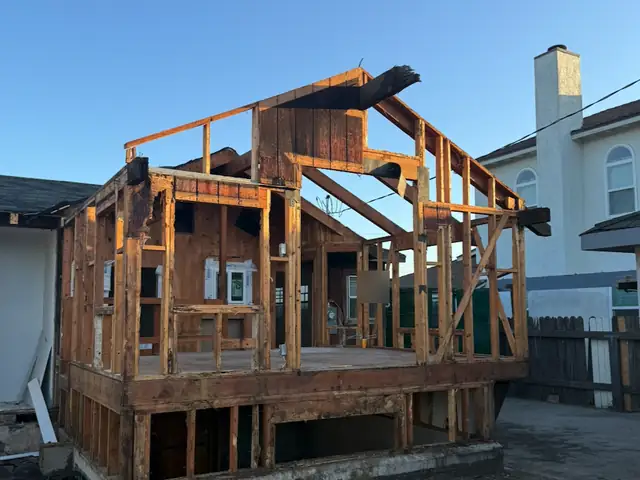 House stripped down to its wood frame during demolition